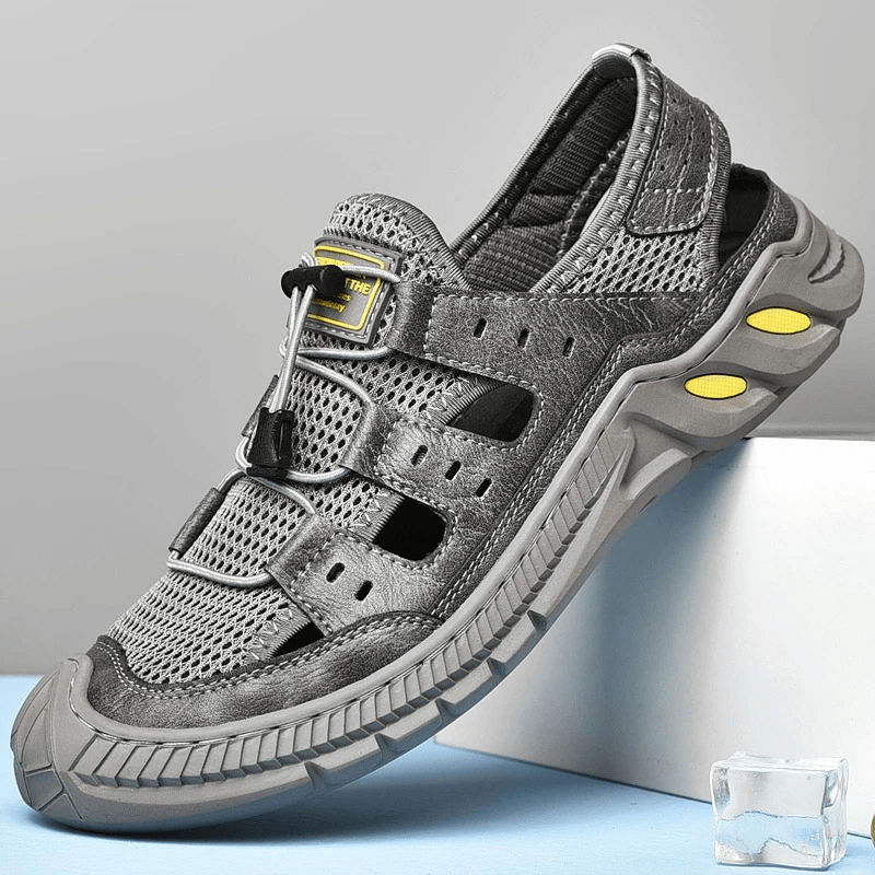 Stylish gray mesh sandals with wear-resistant rubber sole, breathable design, and elastic band closure. Perfect for trendy comfort.