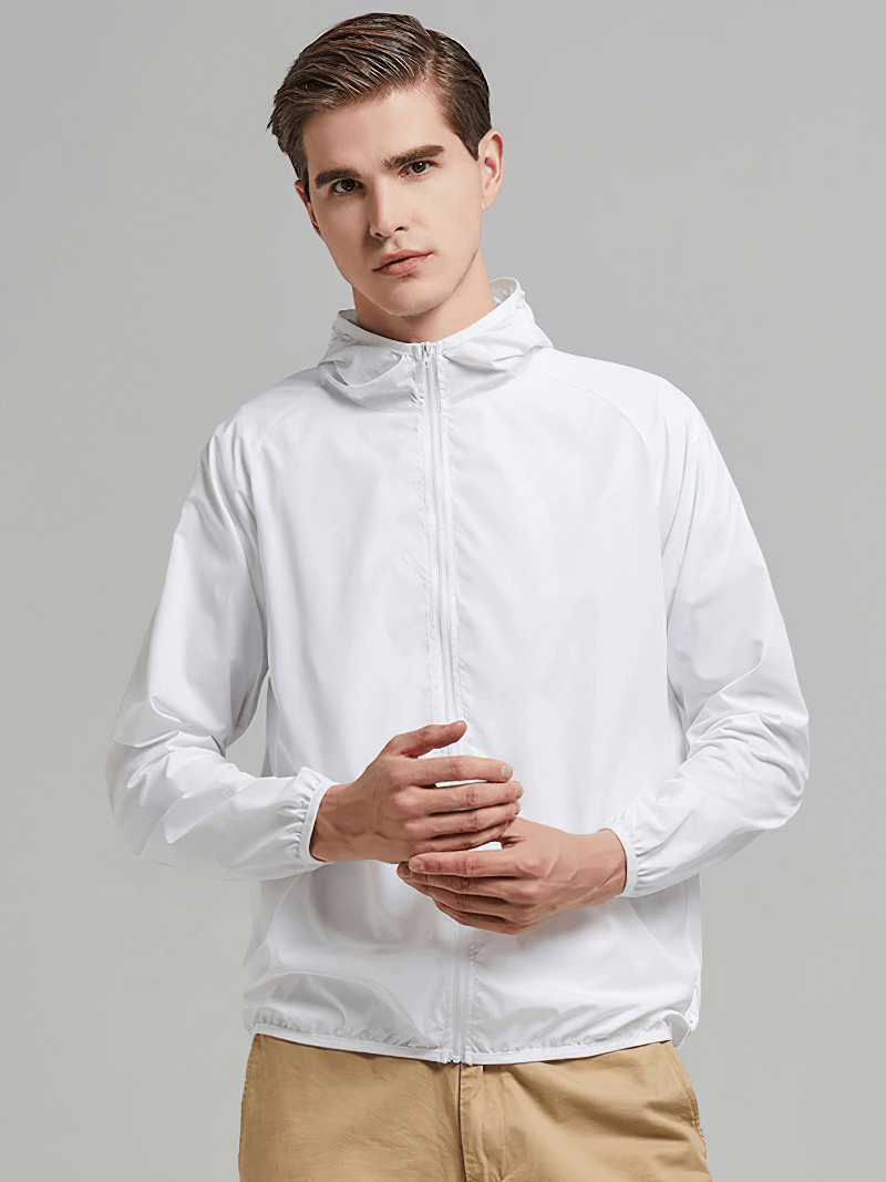 Person wearing a white waterproof hooded jacket with pockets, SF0377, unisex design; ideal for outdoor activities, windproof, sun-protective.