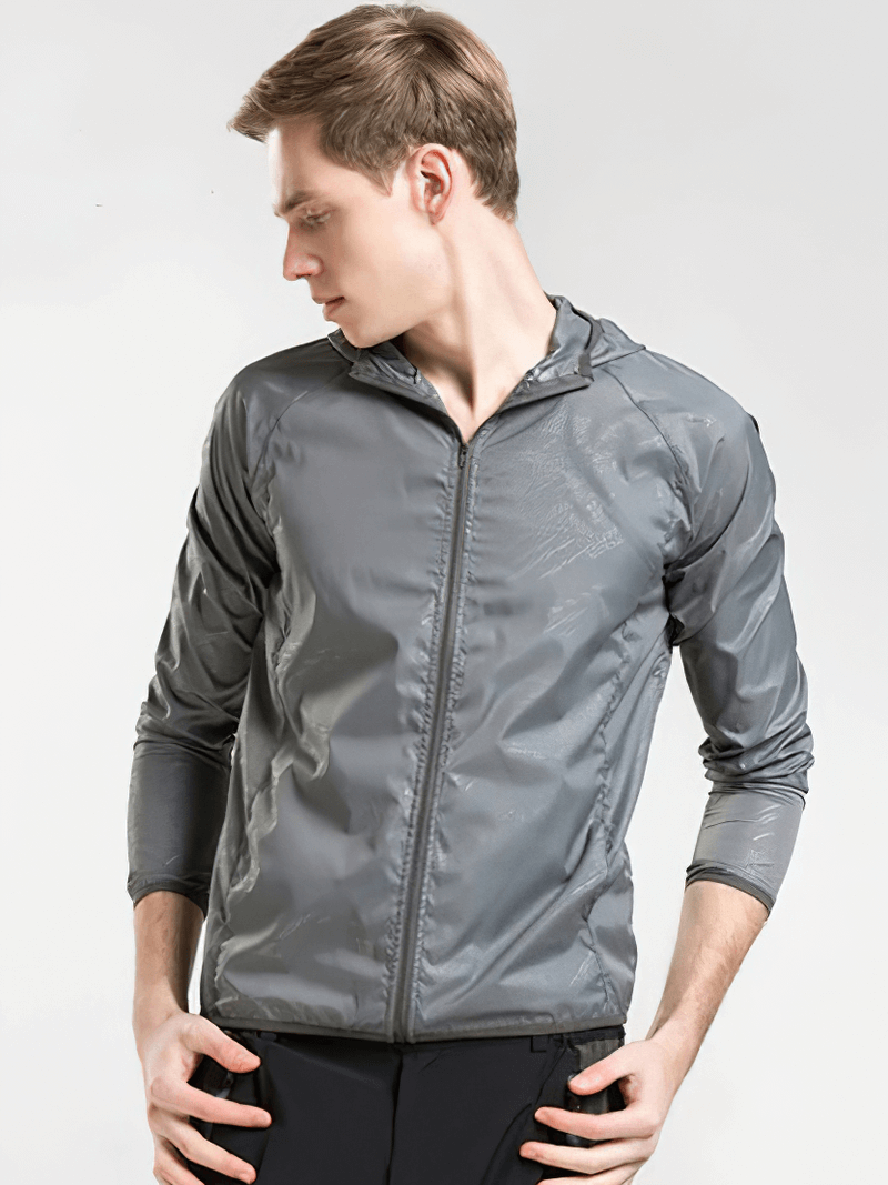 Unisex waterproof hooded jacket in gray, showcasing durable, quick-dry nylon with windproof and sun-protection features.
