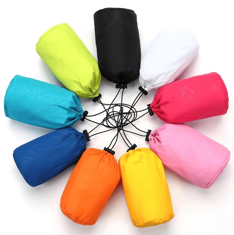 Colorful circle of waterproof hooded jackets in compact pouches.