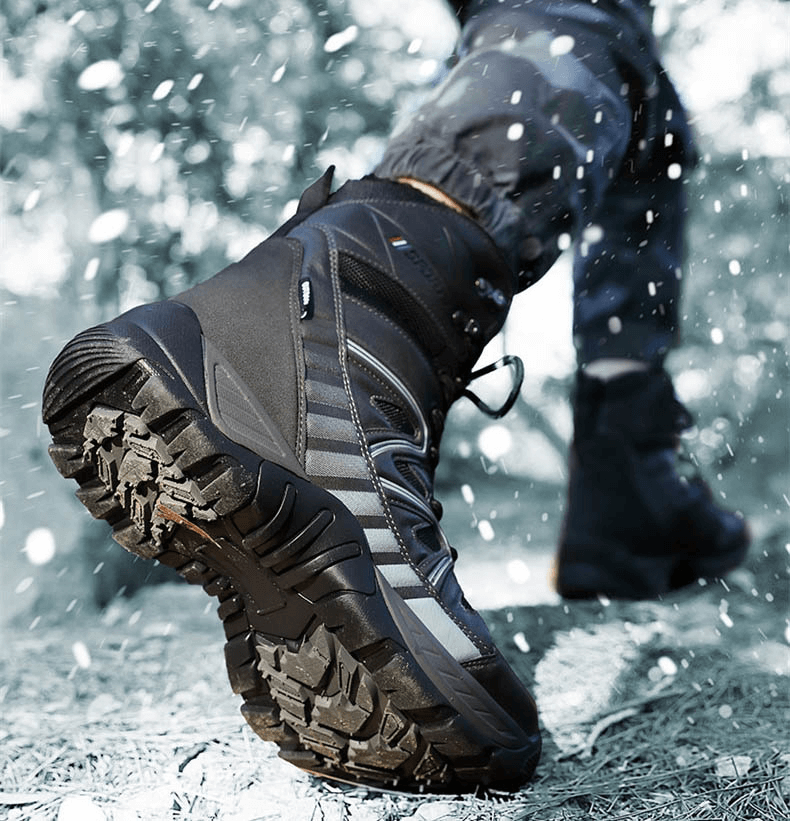 Man wearing Waterproof Leather Anti-Slip Military Snow Boots with Warm Plush, SF0804, walking through snowy terrain. Perfect for cold weather.