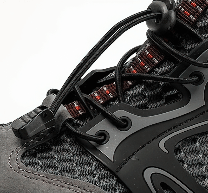 Close-up of waterproof non-slip climbing sneaker with durable lacing system and stylish design.