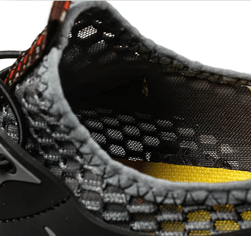 Close-up of air mesh design on men's waterproof climbing sneaker, showcasing breathable material and stylish patchwork.