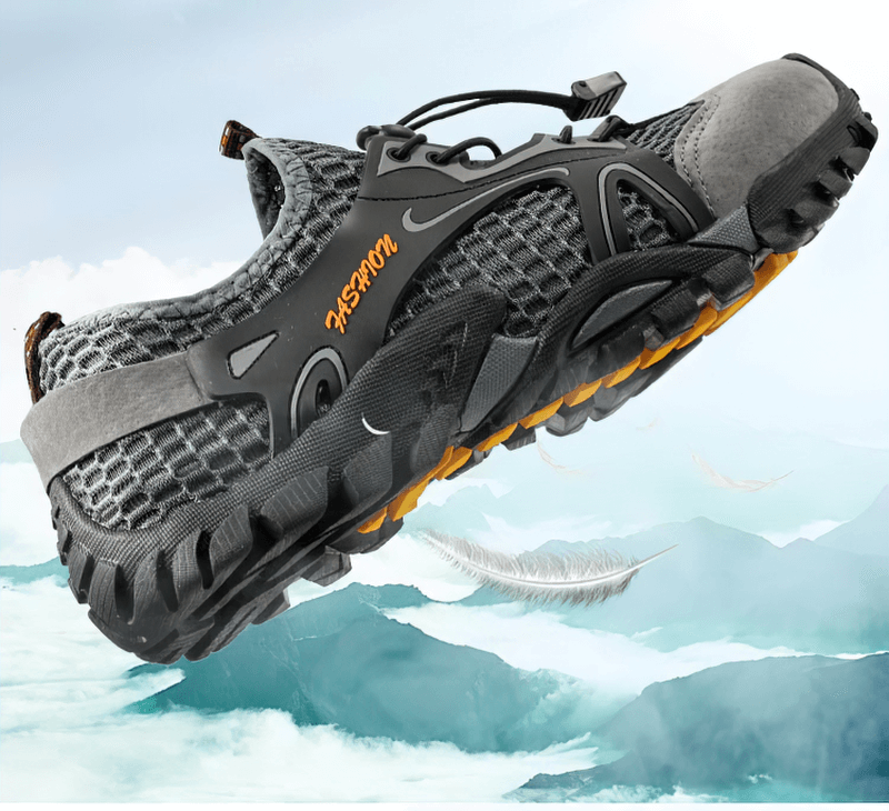 Men's waterproof non-slip climbing sneakers SF0579 with patchwork design and rubber outsole against a mountain backdrop.