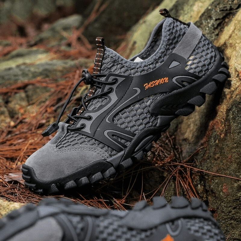 Men's waterproof non-slip climbing sneakers in gray with stylish design, providing comfort and traction for hiking.