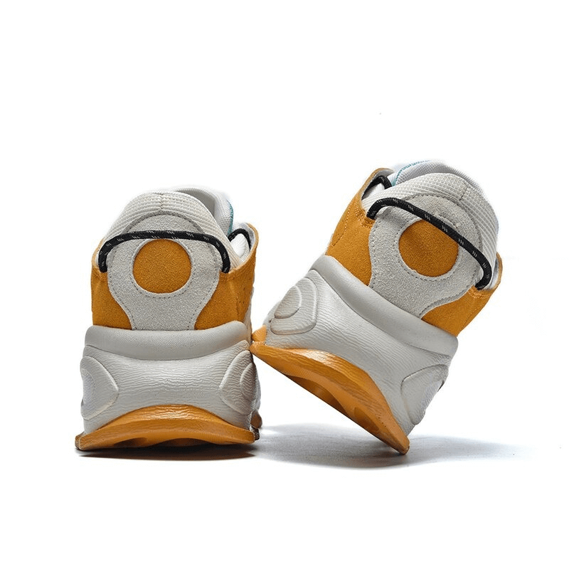 Back view of orange and white waterproof running shoes with thick soles, perfect for outdoor walking and stability. Model SF0376.