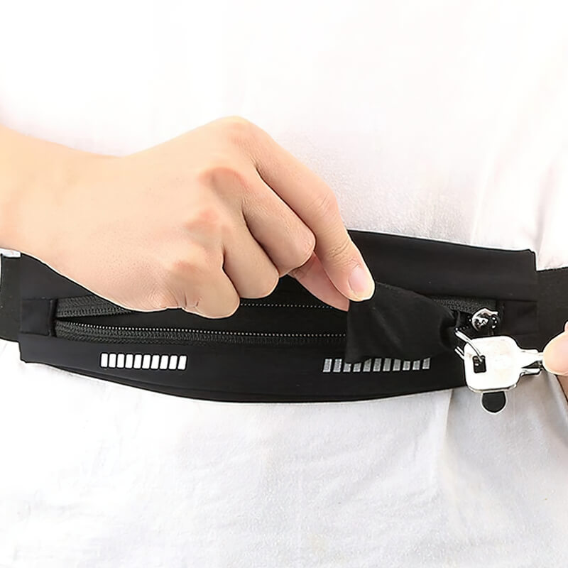 Person using black waterproof waist running bag with zipper, ideal for sports. Unisex design, fits phones up to 7 inches.