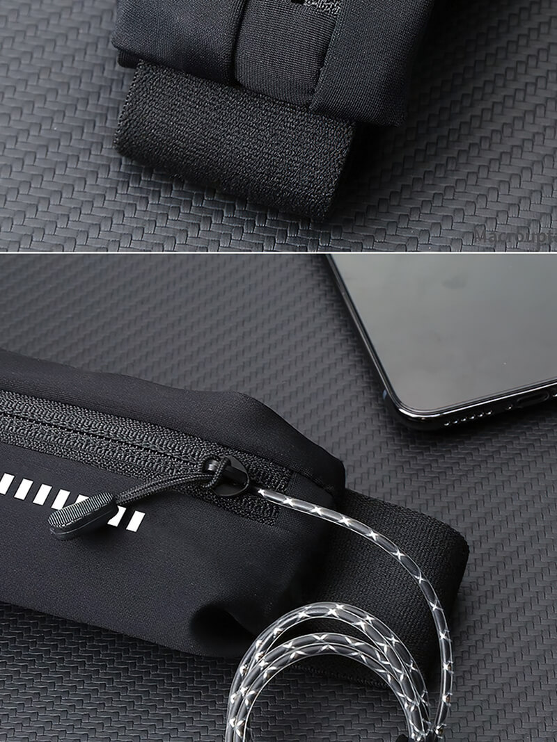 Close-up of a black waterproof nylon waist running bag with zippered pocket, suitable for holding a mobile phone, shown on textured surface.