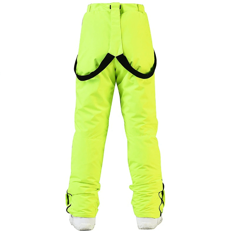 Bright green waterproof snowboarding trousers with black waist protection, featuring full length and adjustable waist for extreme conditions.
