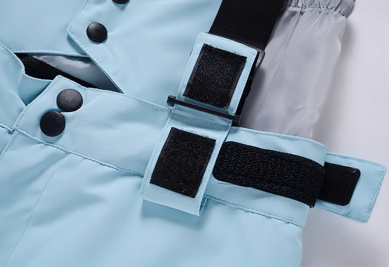 Detail of waterproof warm snowboarding trousers SF0688 showing adjustable waist with snap buttons and velcro closure.