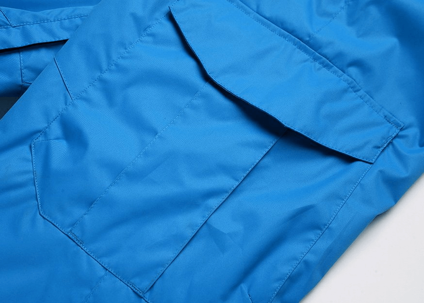 Close-up of blue waterproof windproof insulated sports men's pants, featuring durable cotton fabric and practical pocket design.