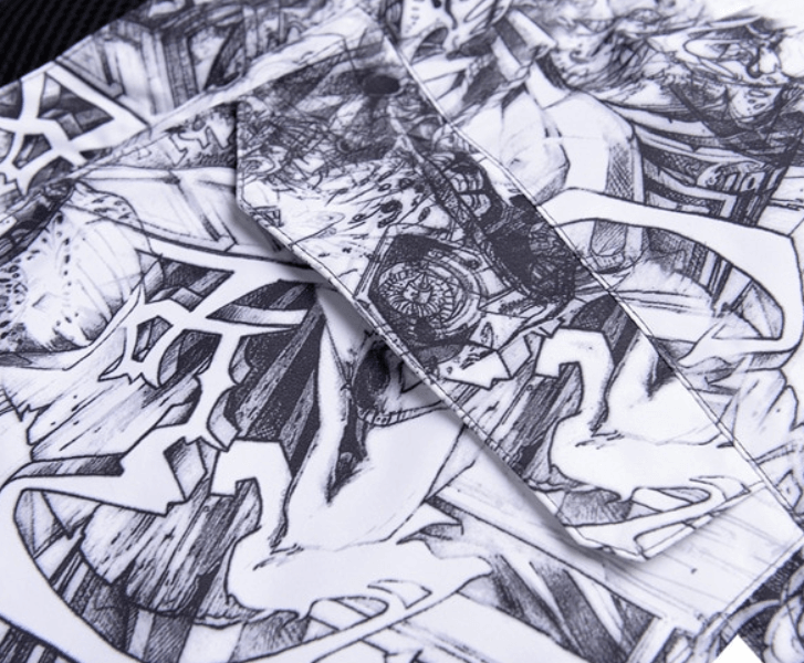 Close-up of artistic black and white abstract pattern on fabric, featuring intricate designs and geometric shapes.