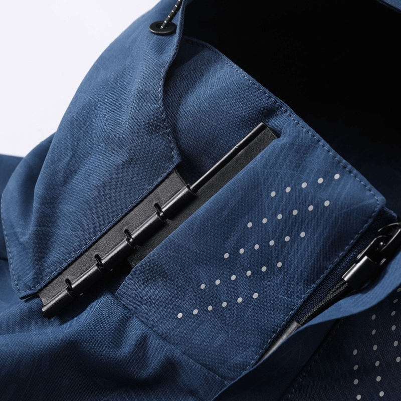 Close-up of a blue waterproof and windproof men's jacket with quick dry technology and zipper detail