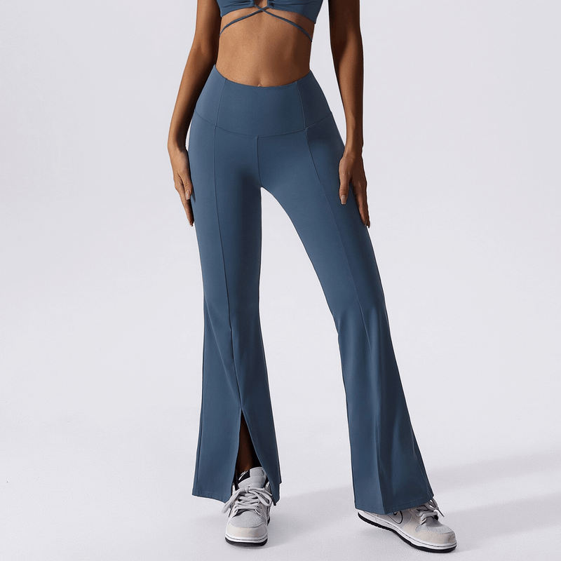 Woman wearing wide-leg yoga high waist pants in blue for fitness activities, showcasing style and flexibility. Perfect for yoga or running.