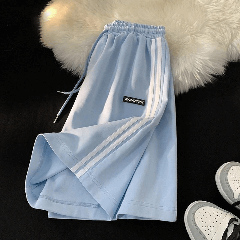 Wide Sport Casual Women's Shorts with Elastic, light blue, polyester, mid-waist, loose fit, ideal for active wear. Model SF0195.