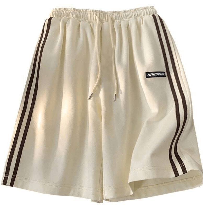 Wide sport casual women's shorts with elastic waistband and side stripes, perfect for active movement and comfort.