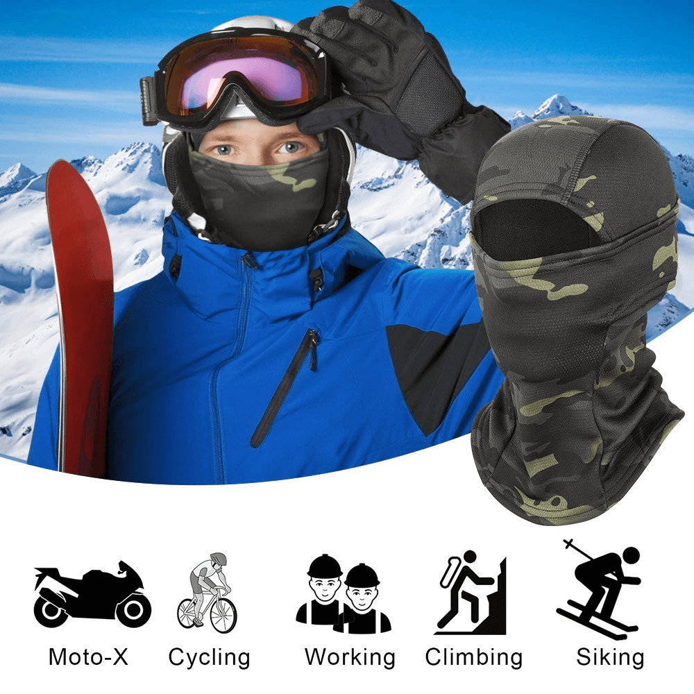 Person wearing windproof camouflage balaclava and ski gear in snowy mountains; perfect for winter sports and outdoor adventures.