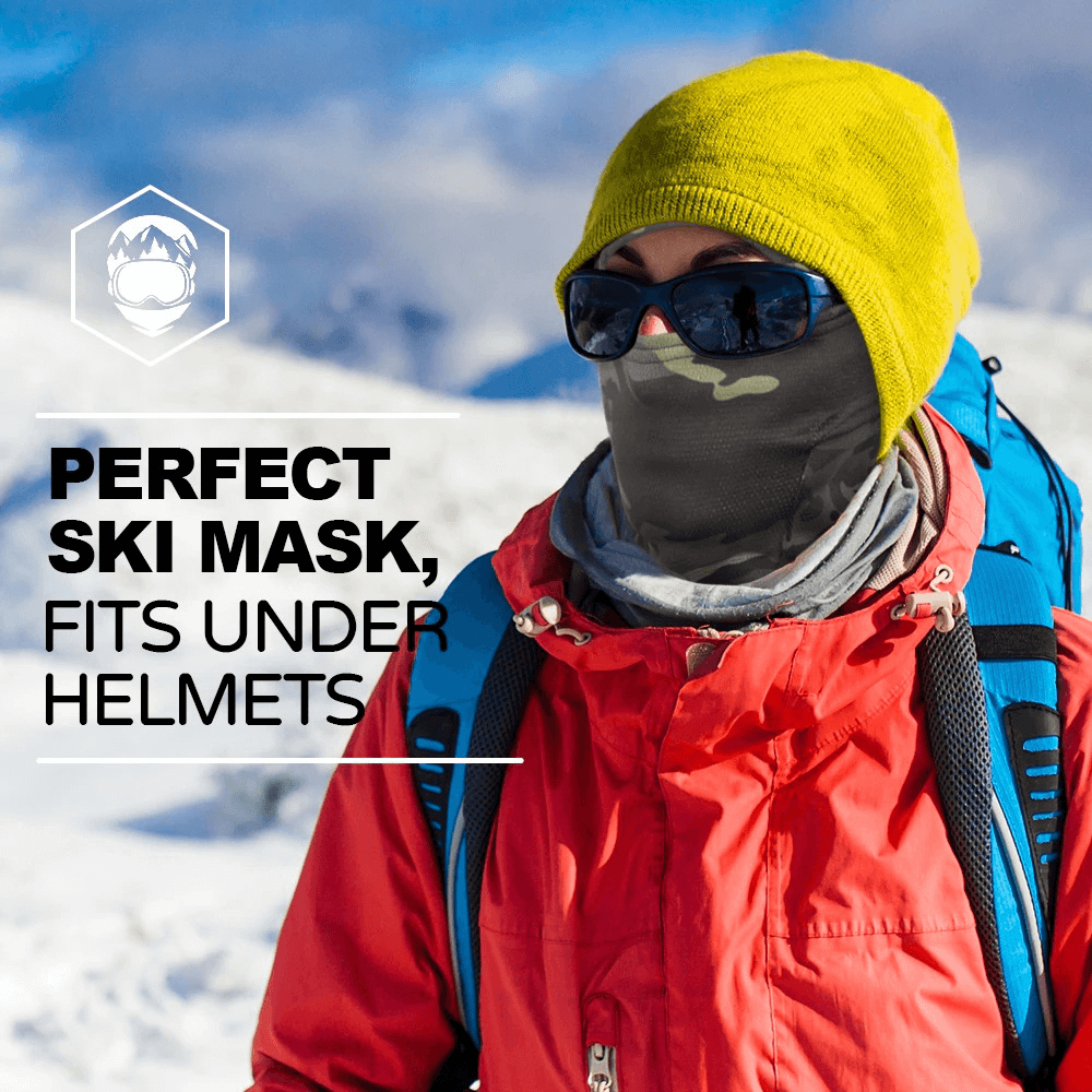 Person wearing a windproof camouflage scarf-balaclava ski mask with a yellow beanie on a snowy mountain, perfect for winter sports.