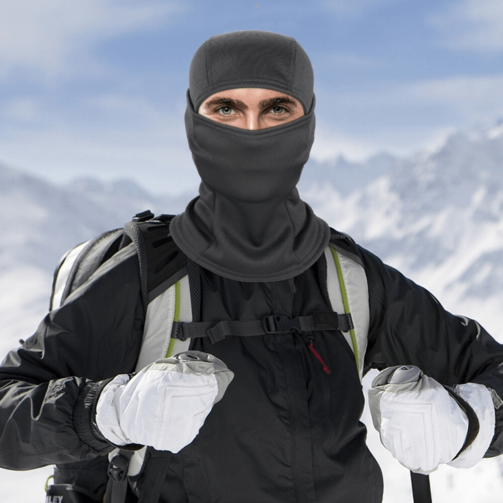 Person wearing windproof camouflage balaclava in snowy mountains, perfect for winter motosiklet activities, unisex design SF0425.