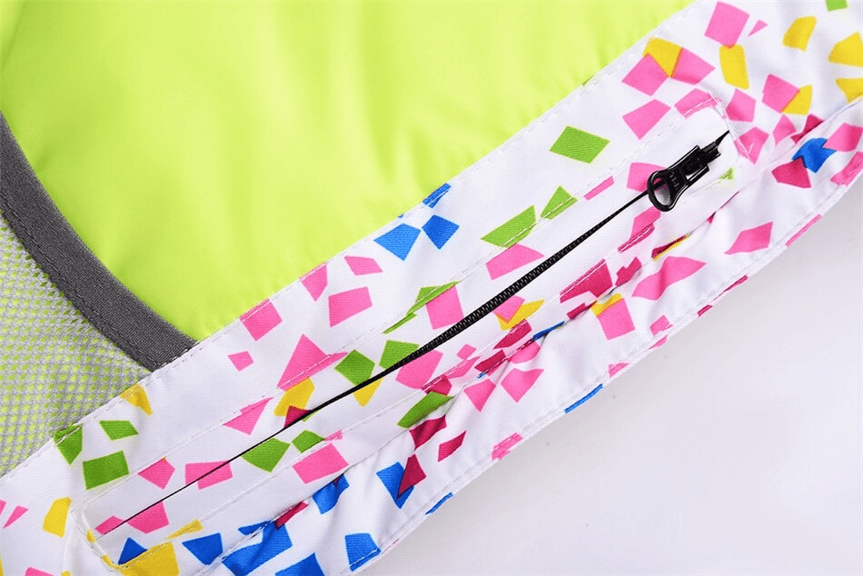 Close-up of a multicolor windproof skiing jacket zipper detail for women, designed for optimal comfort and protection.