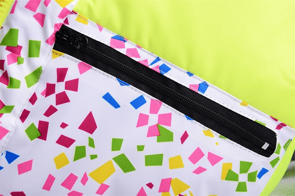Close-up of colorful zipper on windproof skiing jacket for women, showcasing multicolor geometric design and durable cotton fabric.
