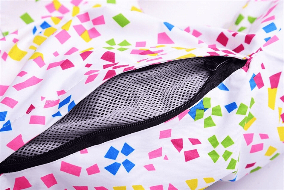 Close-up of windproof multicolor skiing jacket with zipper, showing breathable material for women's sports clothing.