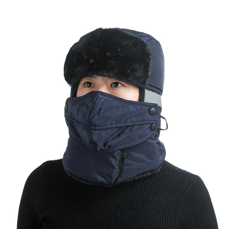 Unisex winter windproof ski cap with earflaps and closed neck in navy, perfect for frigid temperatures and mountain sports. Model wearing cap.