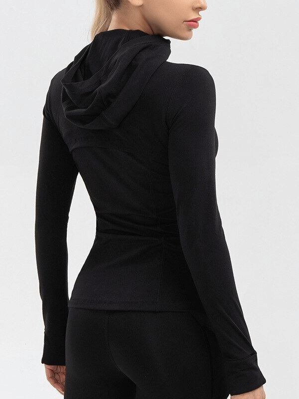 Back view of women's long-sleeve black quick-drying sports shirt for yoga, SF0140, with hood, crafted for comfort and flexibility.