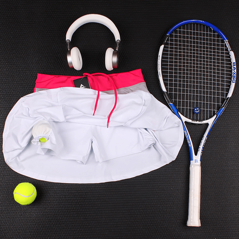 Women's breathable tennis skirt-shorts with pocket displayed with headphones, tennis racket, ball, and shuttlecock. SF0217