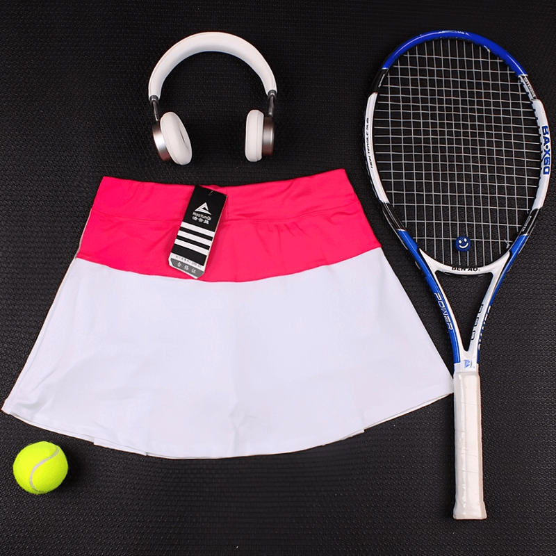 Women's Breathable Tennis Skirt-Shorts with Pocket in white and pink, alongside tennis racquet, ball, and headphones.