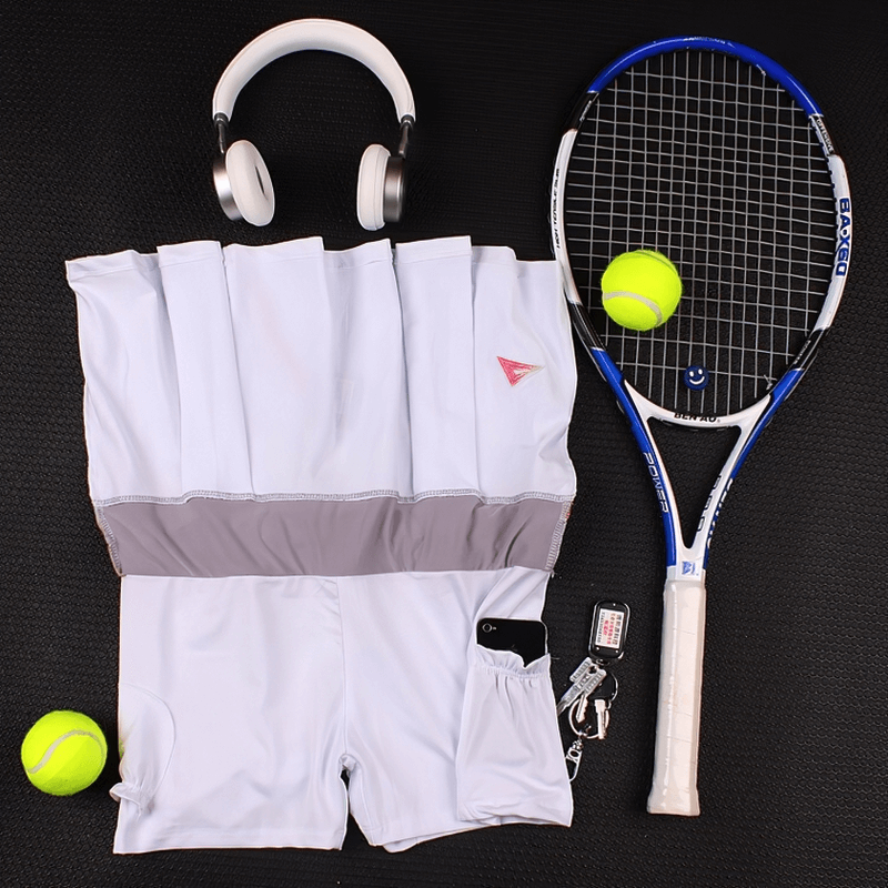 Women's breathable white tennis skirt-shorts with pocket, paired with a tennis racket, balls, and headphones, ideal for sports activities.