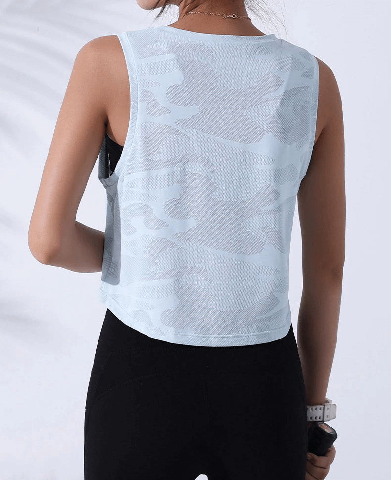 Back view of women's camouflage running tank top, breathable crop for fitness and sports, showcasing light blue design.