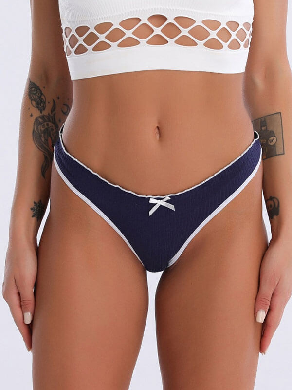 Women's low-rise T-back G-string panties, navy blue with white trim and bow. Breathable cotton comfort, secure fit. Style SF0967.