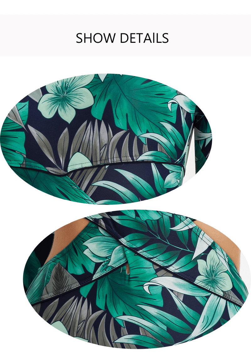 Close-up of cut-out waist flower print one-piece swimsuit in green and navy, highlighting the floral design on women's swimwear.
