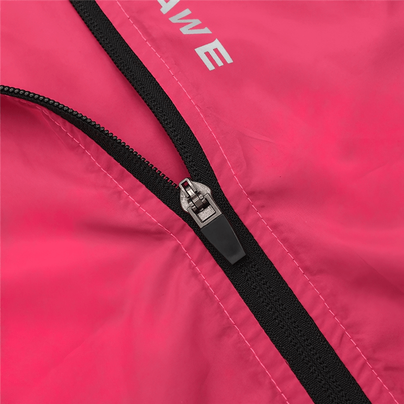 Close-up of zipper and reflective logo on women's red cycling windproof vest, showcasing durable polyester fabric.
