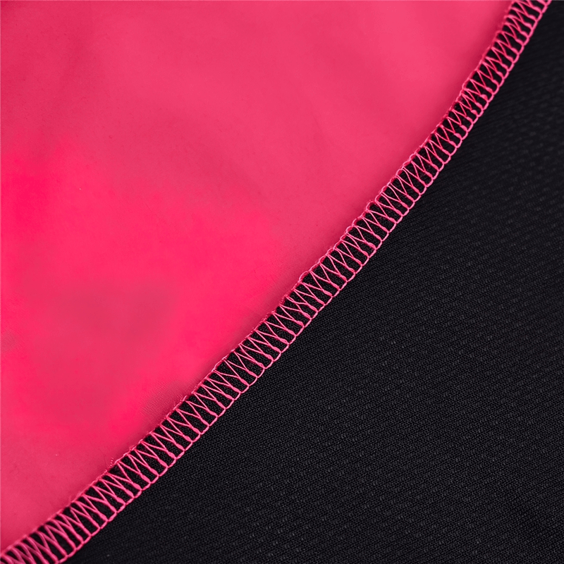 Close-up of red and black cycling vest with detailed stitching, highlighting windproof and breathable fabric features.