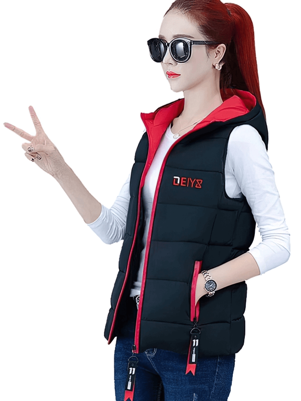 Woman modeling a stylish black women's down vest with red zipper pockets, hooded collar, perfect for chilly weather comfort and style.