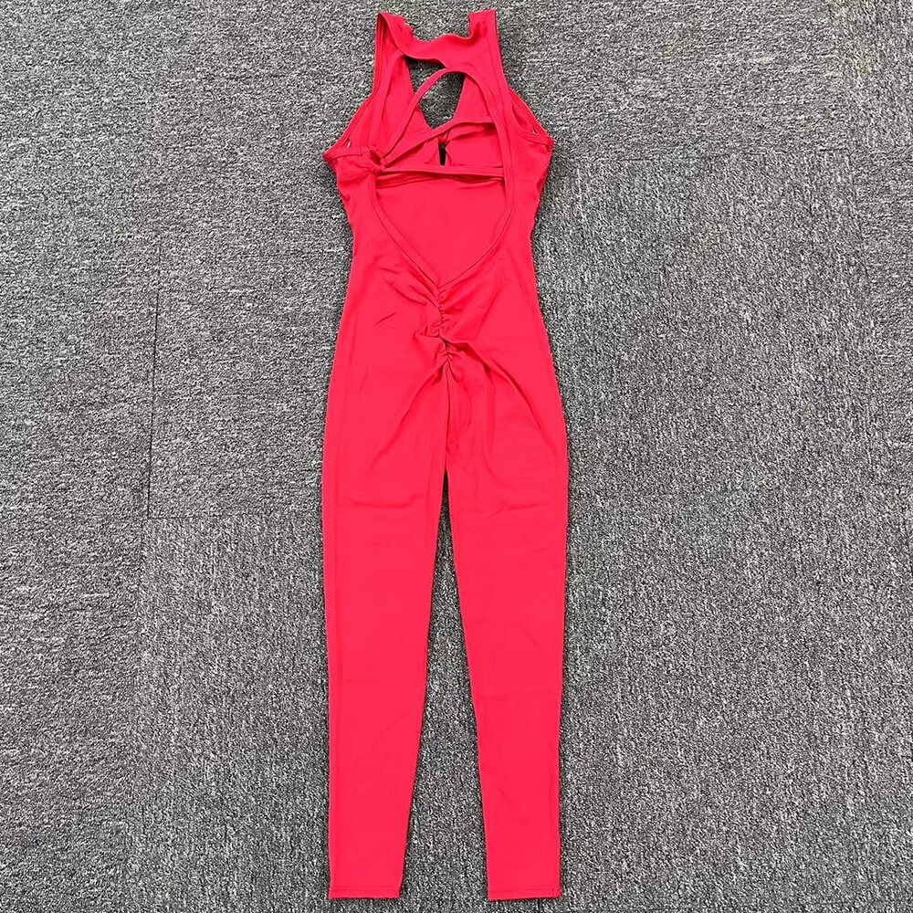 Women's red fitness jumpsuit with asymmetrical back, sleeveless design in lightweight Lycra blend, ideal for yoga and workouts.