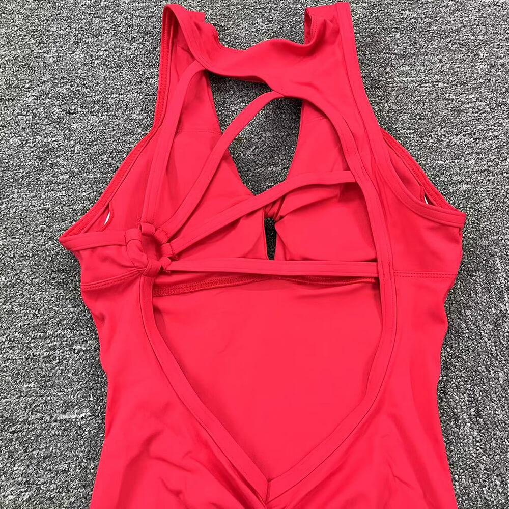 Women's red jumpsuit with asymmetrical back design, made from breathable Lycra, featuring sleeveless cut and anti-pilling material.