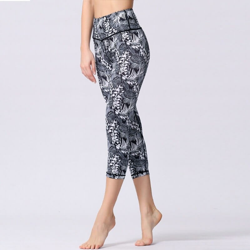Model wearing high waist women's floral sports leggings, perfect for yoga and fitness. Breathable nylon-spandex blend. Style SF1034.