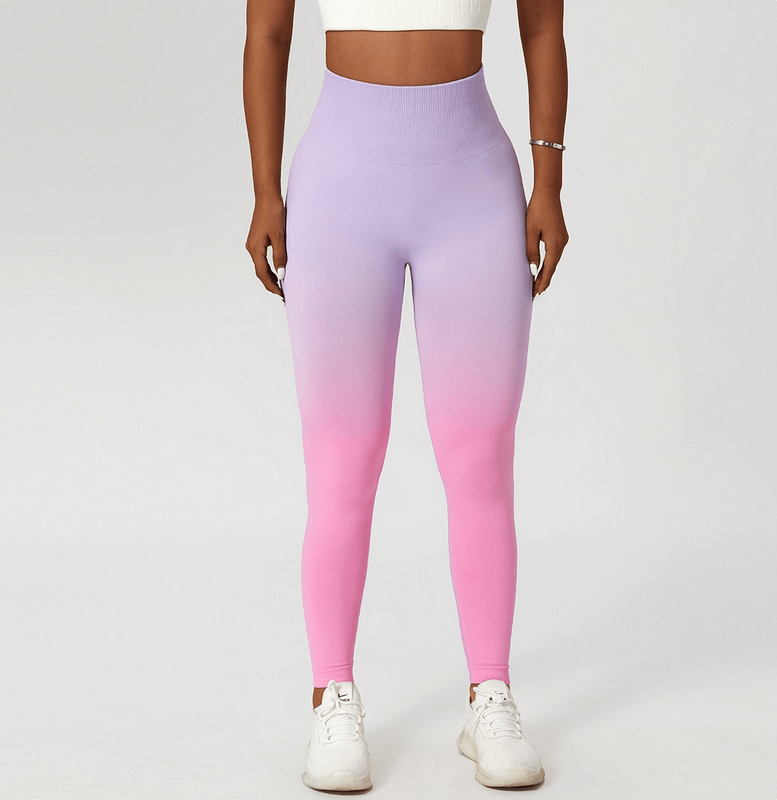 Woman modeling gradient pink and purple seamless high waist leggings for yoga, emphasizing comfort and style for active lifestyles.