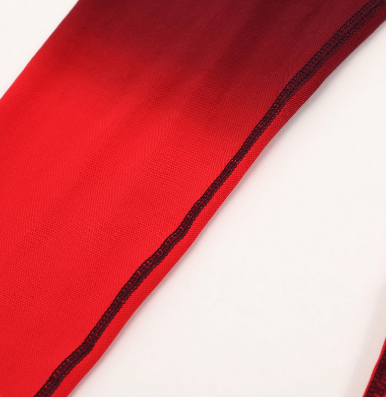 Close-up of women's red gradient seamless high waist leggings showcasing the elastic fabric for yoga, fitness, and sports.