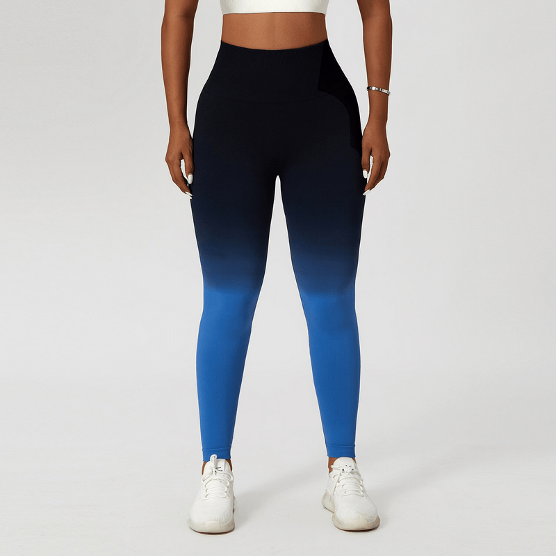 Woman wearing blue gradient high waist yoga leggings, perfect for active workouts and sport activities. Ankle-length and seamless design.
