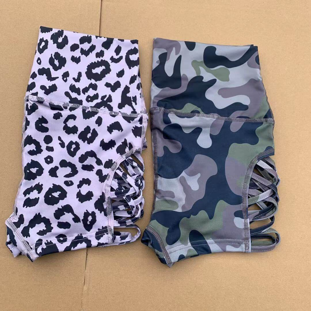 Women's high waist side cross hollow shorts in leopard and camo prints, perfect for fitness and yoga.