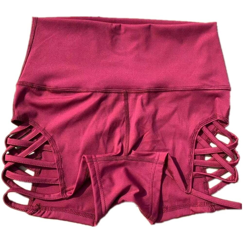 Women's high waist side cross hollow fitness shorts in pink, showcasing unique design, made of nylon and spandex blend for comfort.