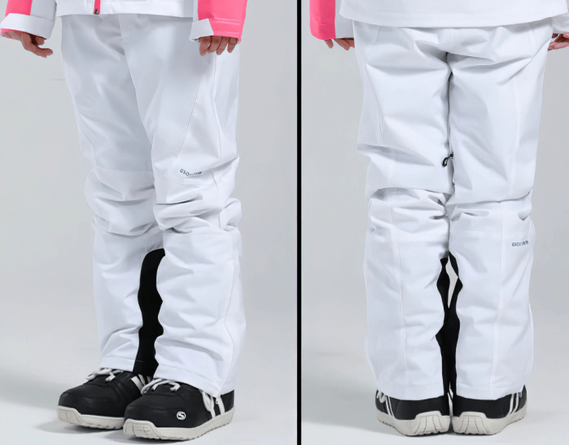Women's high waist snow pants with waterproof zipper pockets, Oxford fabric, in action outdoors, showcasing fit and functionality.