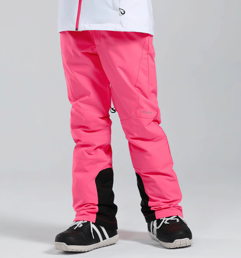 Women's pink high waist snow pants with waterproof zipper pockets, perfect for winter sports, featuring durable fabric and secure closure.