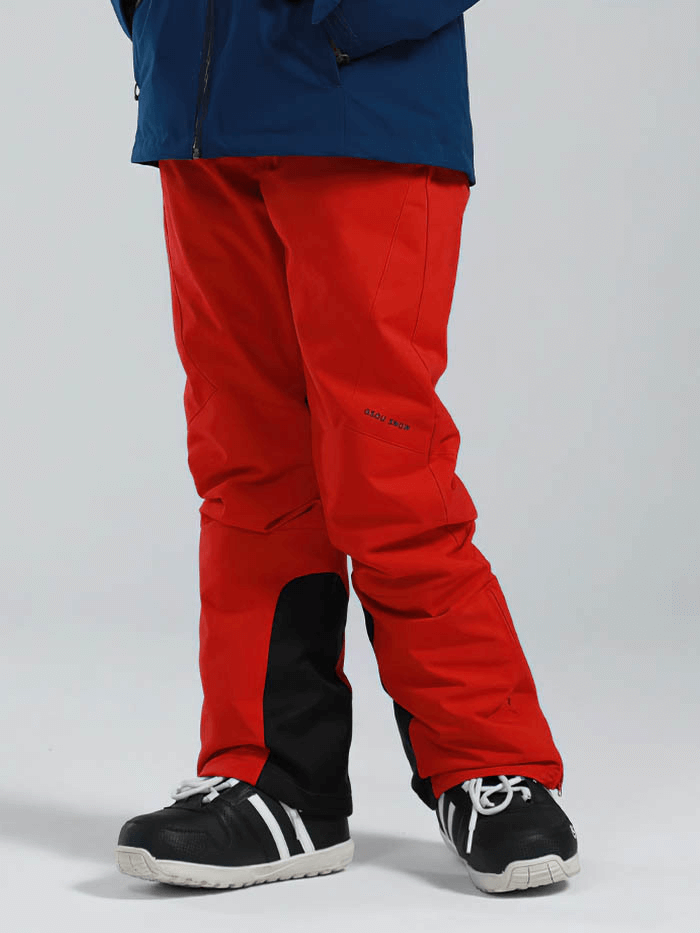 Women's red high waist snow pants with waterproof zipper pockets and durable fabric, perfect for skiing and winter sports.