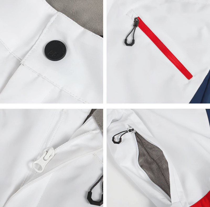 Close-up of women's high waist snow pants with waterproof zippers, including button, zipper detail, and zipper pocket in white fabric.