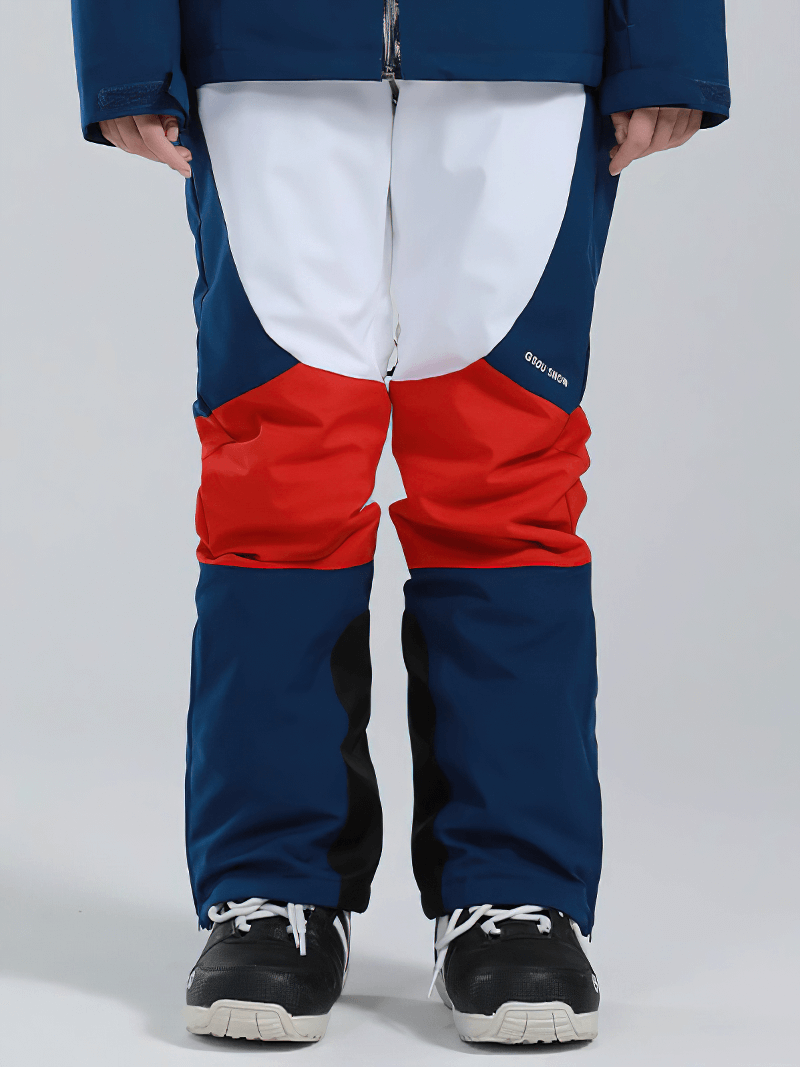 Women's high waist snow pants in blue, red, and white with waterproof zipper pockets, perfect for skiing and winter sports.